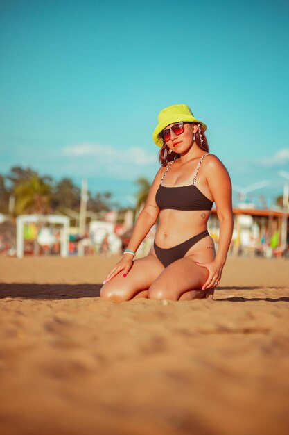 Photo sexy red haired girl at the beach