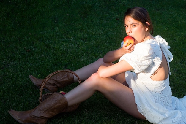 Sexy sensual seductive young woman with tasty apple sensual woman eating apple outdoor portrait sexy