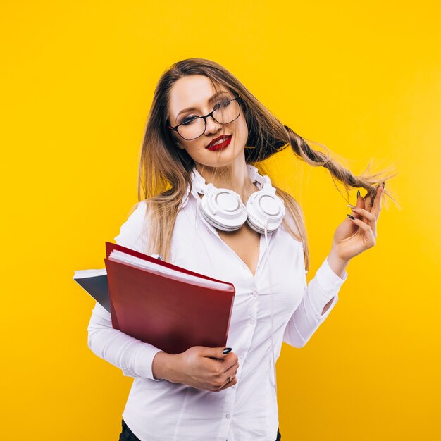 Sexy teacher on a yellow wall