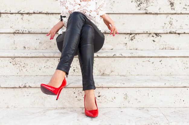 Sexy woman sitting alone on stairs