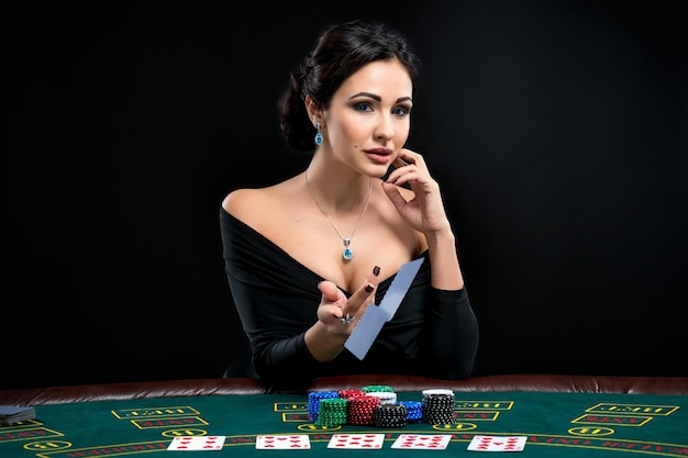 Sexy woman with poker cards and chips