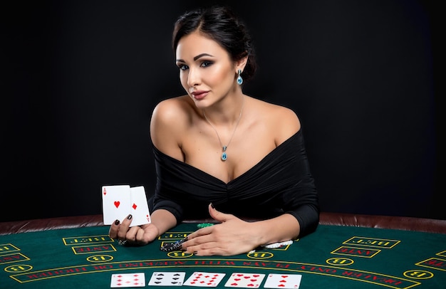 Sexy woman with poker cards and chips