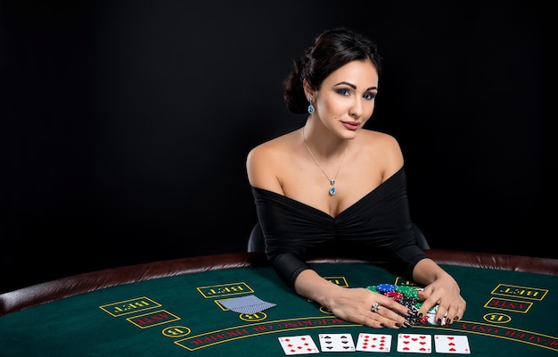 Sexy woman with poker cards and chips