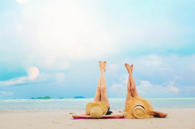 Sexy women freedom vacation relax on the beach enjoy with warm light