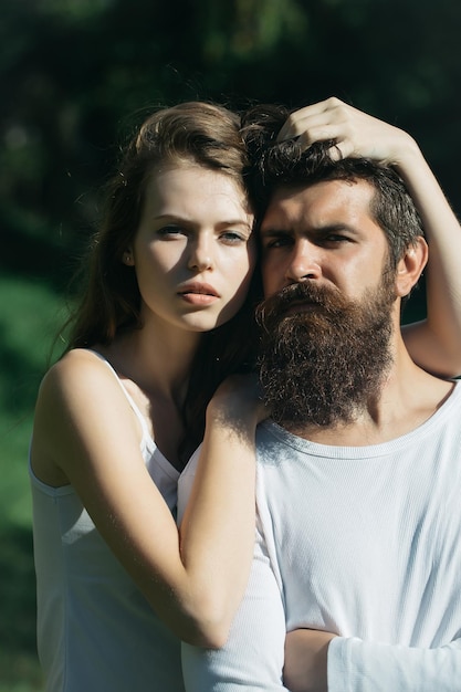 Sexy young couple on green grass