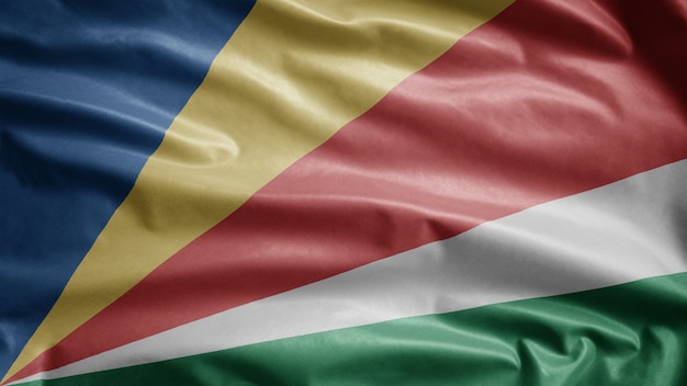 Seychellois flag waving in the wind. Close up of Seychelles template blowing, soft and smooth silk.