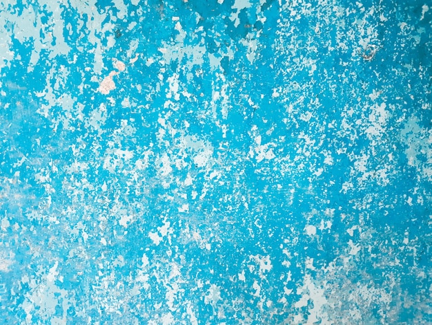 Shabby old flaky blue paint background.