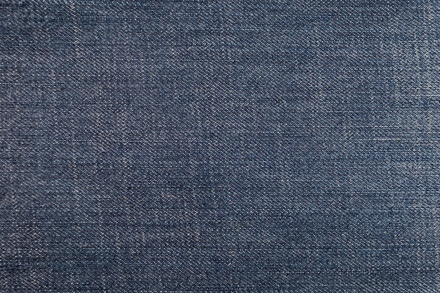 Фото Потертые традиционные синие джинсовые джинсы текстуры