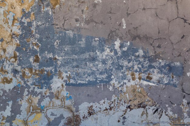 Shabby weathered artistically peeled off blue and gray paint