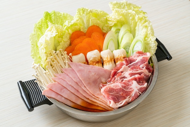 Shabu hot pot black soup with meat raw and vegetable - Japanese food style