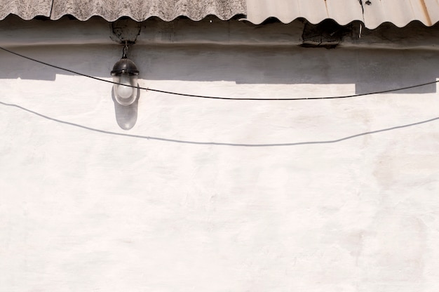 Shade against a white wall and slate