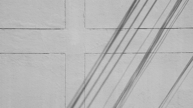 Photo shadow of electric line on cement wall