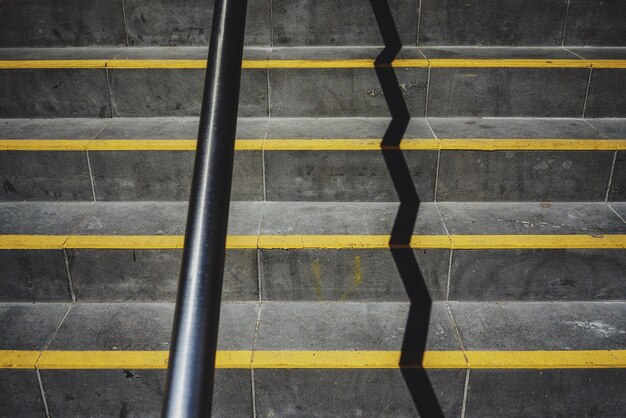 Photo shadow of metal railing on steps