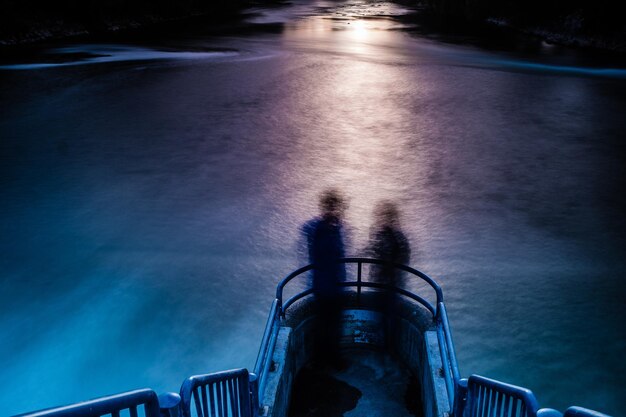 Photo shadow of people on boat at sea