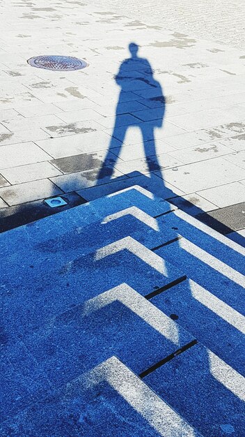 Photo shadow of person on road