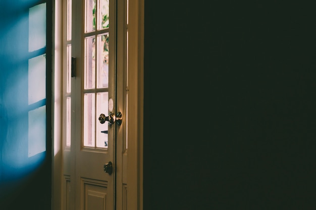 Shadow through the door, black wall