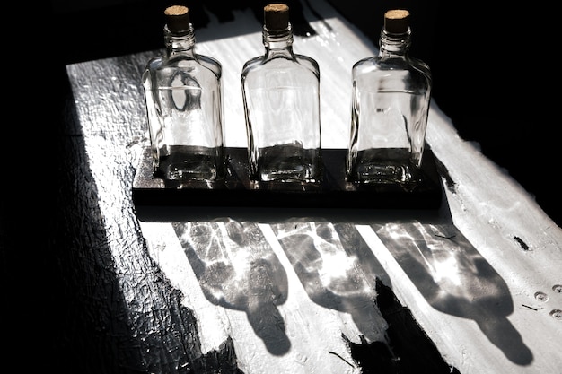 Shadows from the bottles. Creative lighting in home. Loft style.