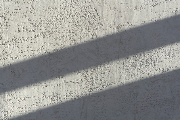 Shadows on the gray concrete wall from the sun. Shadow background.	