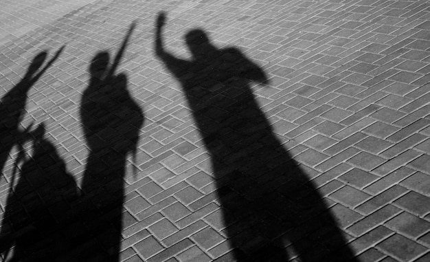 Photo shadows of people on pavement