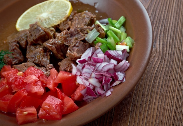 Shahan ful - simplified to ful, is a dish common in Eritrea, Ethiopia, Sudan and the region. served with chopped green onions, tomatoes,