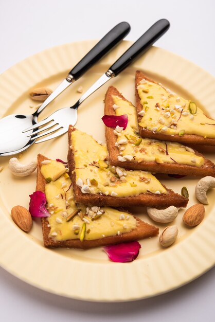 Shahi tukda or tukra also known as double ka meetha is a rich &amp; festive Indian dessert made with bread, ghee, sugar, milk and nuts