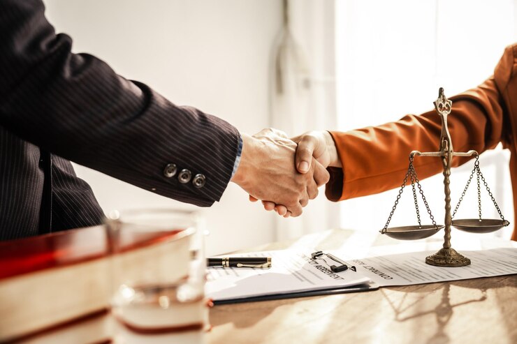 Shaking hands signifies mutual agreement and professionalism It embodies the essence of justice with lawyers judges and authorities collaborating within the framework of law and judgment