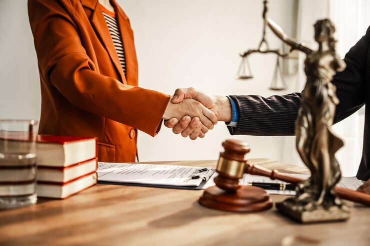 Photo shaking hands signifies mutual agreement and professionalism it embodies the essence of justice with lawyers judges and authorities collaborating within the framework of law and judgment