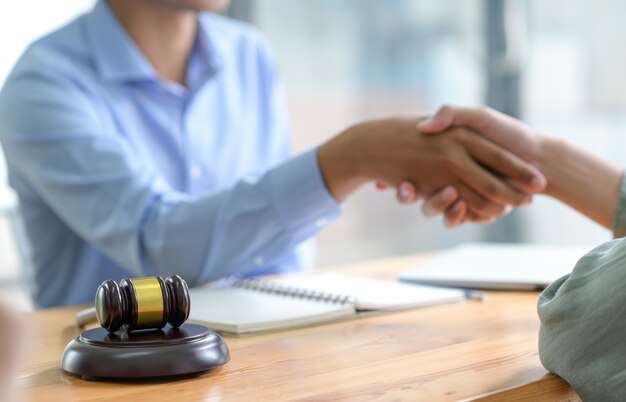 Shaking hands when reaching a legal agreement