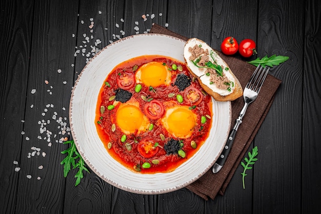 Shakshuka eggs with black caviar