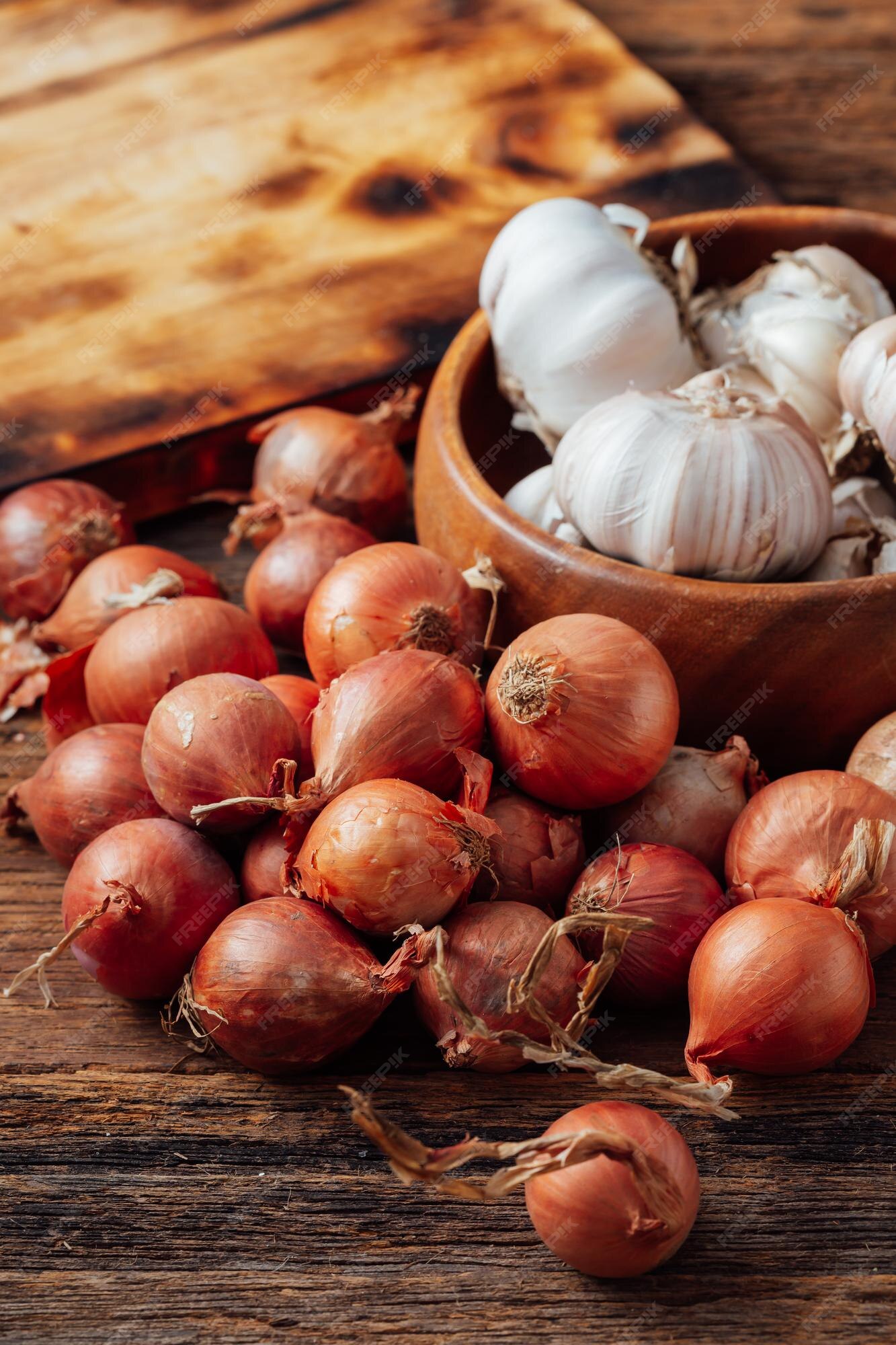 Premium Photo  A sack of garlics shallots and onions