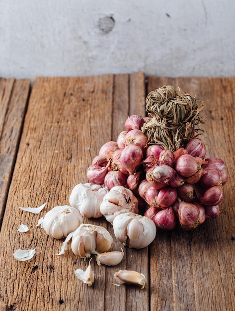 shallots with garlic on wooden table