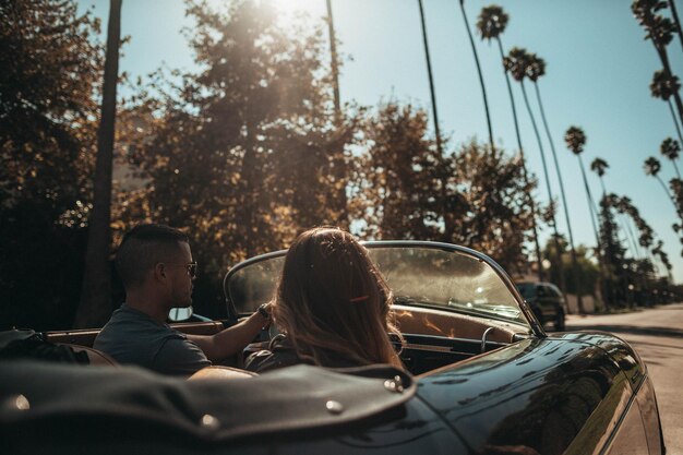 Shallow Focus Photo of People Riding Convertible Coupe Photo