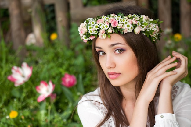 Shallow focus shot if a beautiful girl in a flowers crown