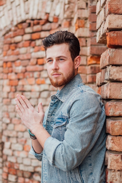 Shallow focus shot of a young and attractive male posing at camera