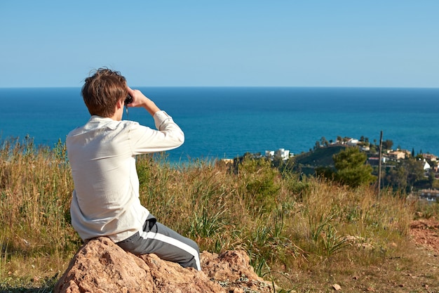 A shallow focus shot of a young man from Spain