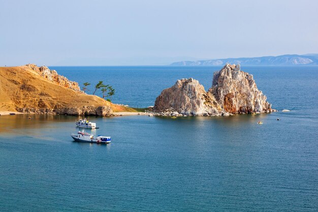 Shamanka (shamans rock) on baikal lake near khuzhir at olkhon\
island in siberia, russia. lake baikal is the largest freshwater\
lake in the world.