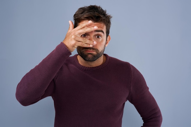 Photo shame employee and man with cover on face and mistake in headline of news sad and stress for job blue background journalist and person with hiding of eye portrait and embarrassed of work in usa