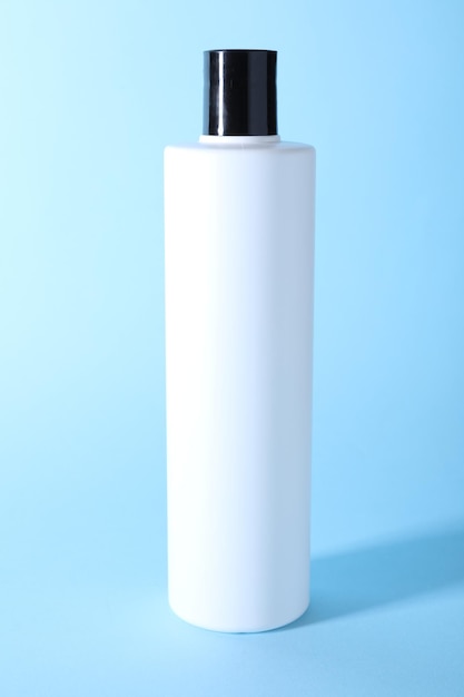 shampoo in bottle on light blue background personal care product