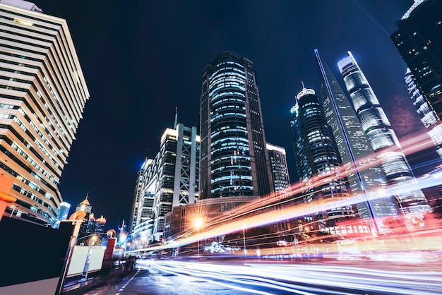 Shanghai city buildings at night and blurred car lights