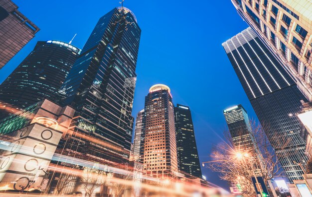 Shanghai city buildings at night and blurred car lights