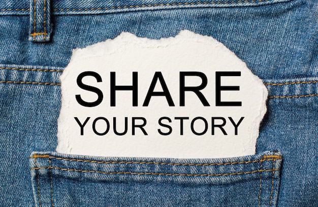 Share your story on torn paper background on jeans business and finance concept