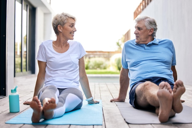 Sharing in a more holistic lifestyle together Shot of a mature couple taking a break while exercising outdoors
