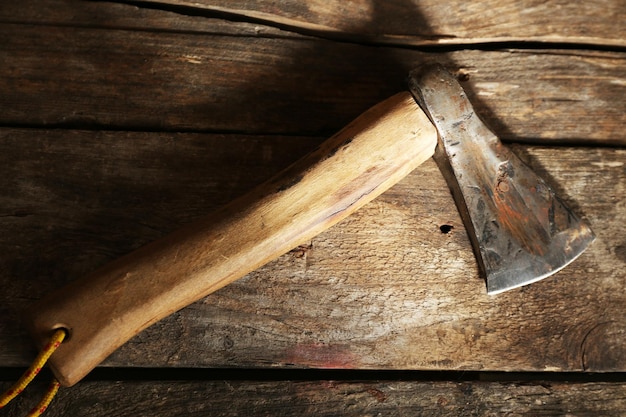 Sharp axe on wooden background