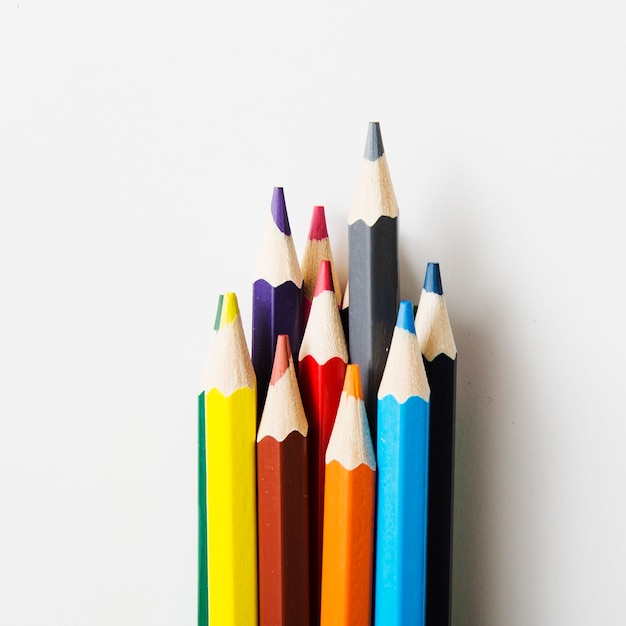 Sharp colored pencils against white background