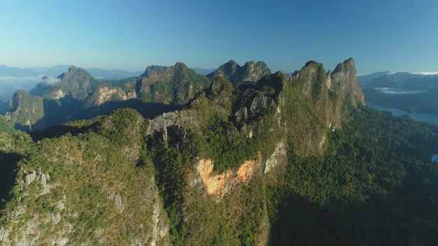 Sharp mountain peaks sunshine aerial view drone