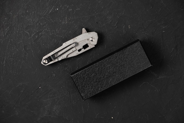 Sharp pocketknife on a black background