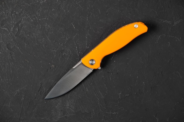 Sharp pocketknife on a black background