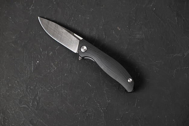 Sharp pocketknife on a black background