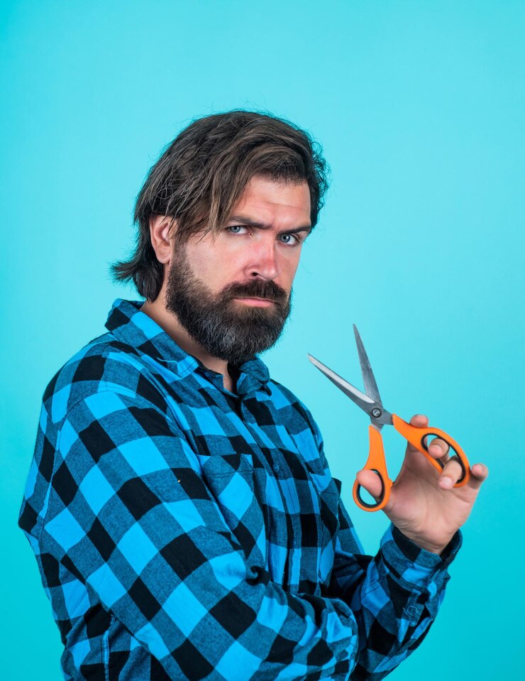 फोटो sharp styled andsome hipster with moustache hairdresser tool barbershop mature barber with scissors bearded man with scissors brutal guy cut his hair hairstyle male fashion look