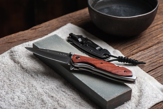 Sharpen the pocket knife with grindstone or whetstone pocket\
knife care and maintenance